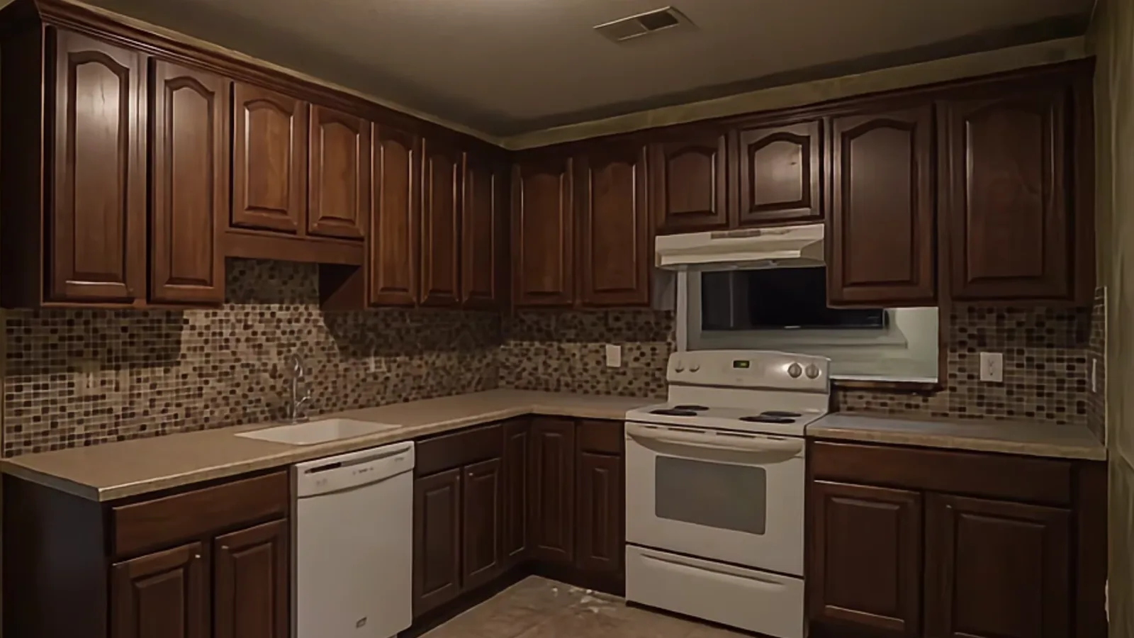 Outdated kitchen transformed into green cabinetry
